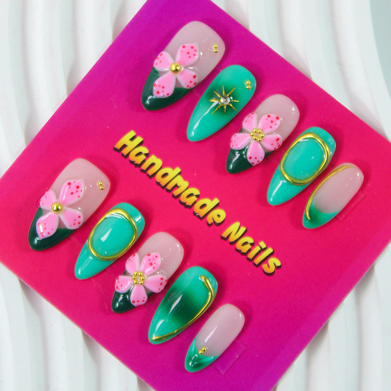 Artificial nails with floral accents and glitter decorations Kalsten