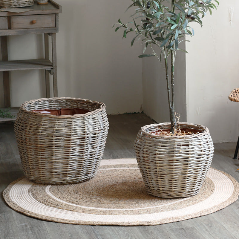 Stylish laundry basket made of braided natural material Kalsten