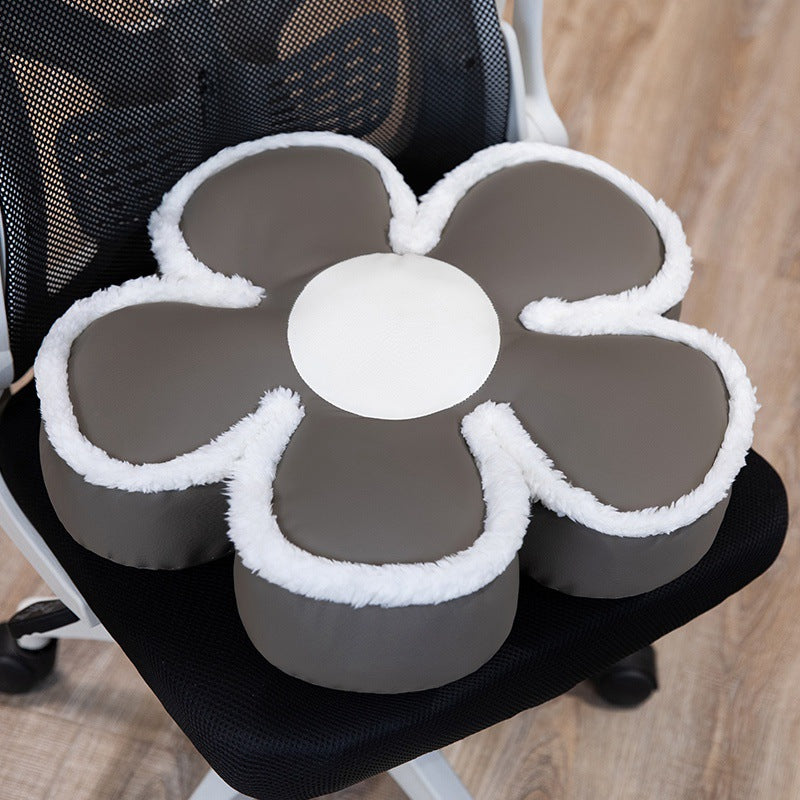 Padded seat cushion in flower shape with faux leather center piece and fluffy edge padding