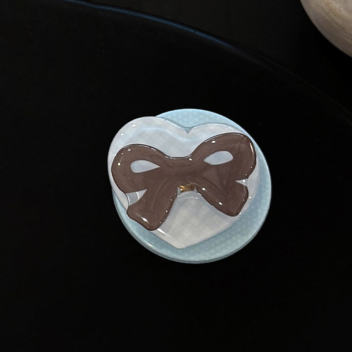 Decorative ceramic coaster with bow motif Kalsten