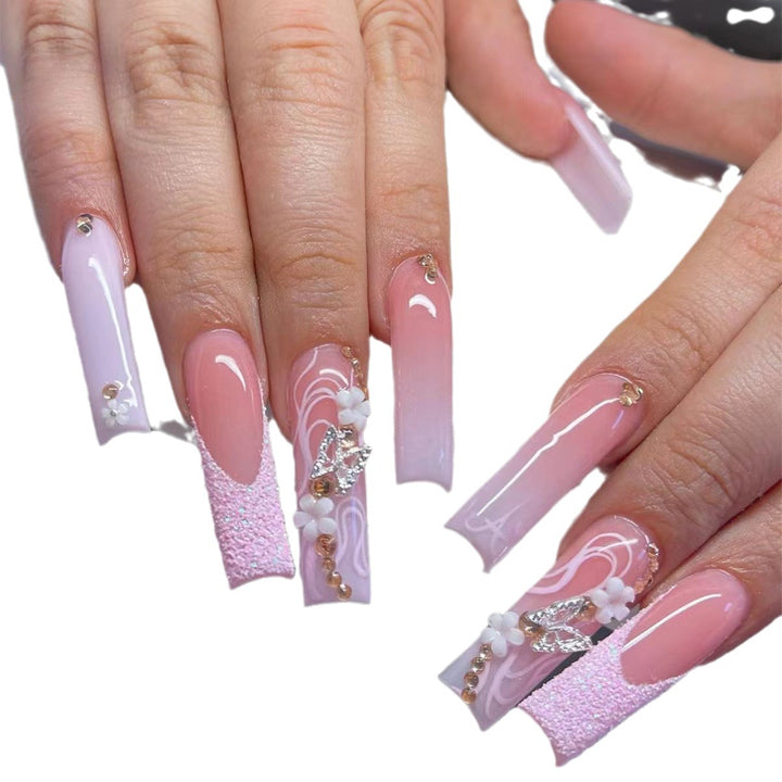 Elegant Long Acrylic Nail Extensions with Decorative Accents