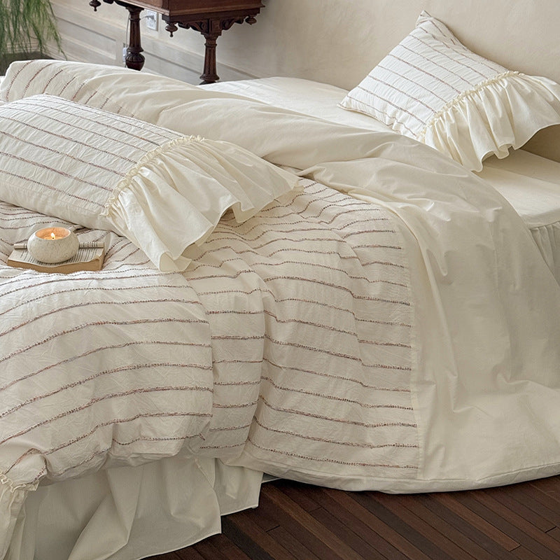 Bedding set made of cotton percale with striped relief embroidery and ruffled bed skirt