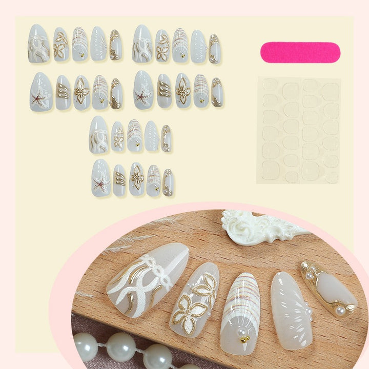 Artificial nail set with filigree gold accents and elegant designs Kalsten