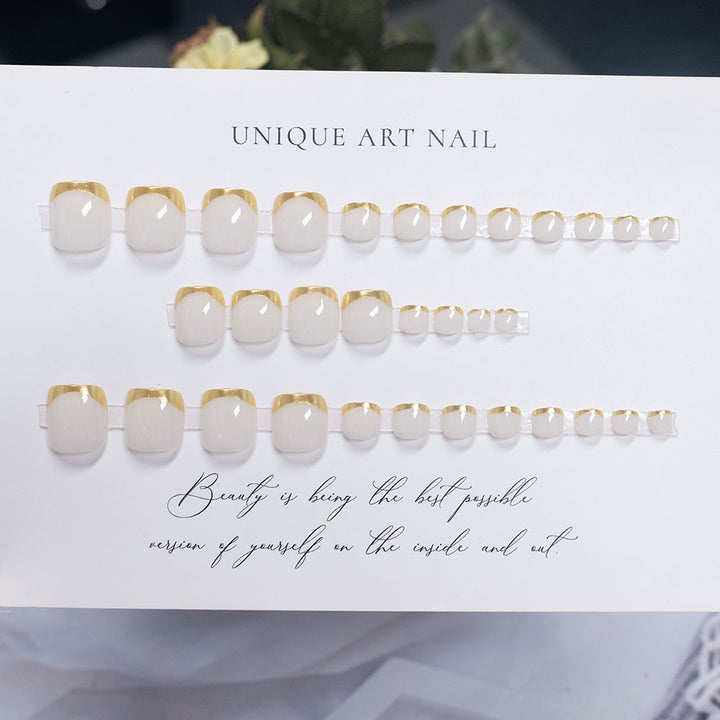 Press-On Nail Art with Elegant Gold Accents