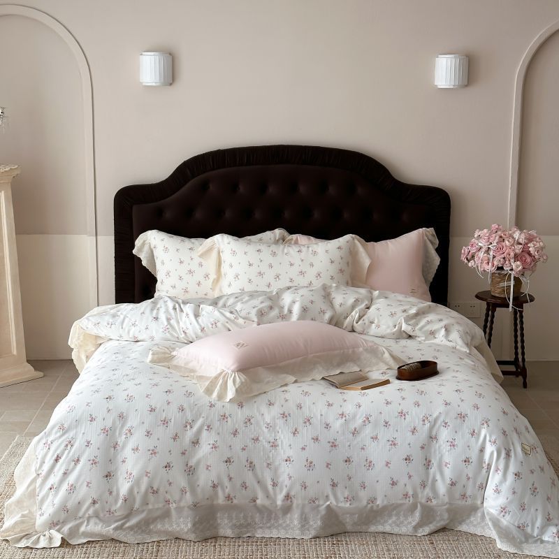 Luxurious cotton satin bed linen set in vintage style with delicate floral pattern and lace trim