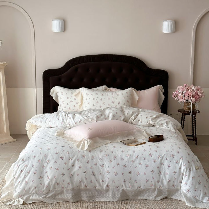 Luxurious cotton satin bed linen set in vintage style with delicate floral pattern and lace trim