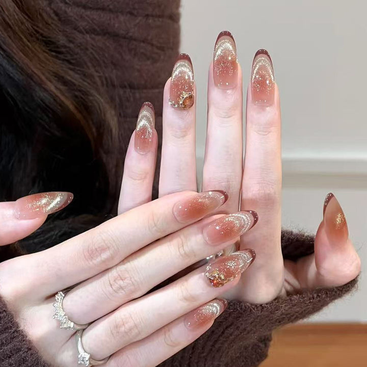 Glamorous artificial nails with creative embellishments Kalsten