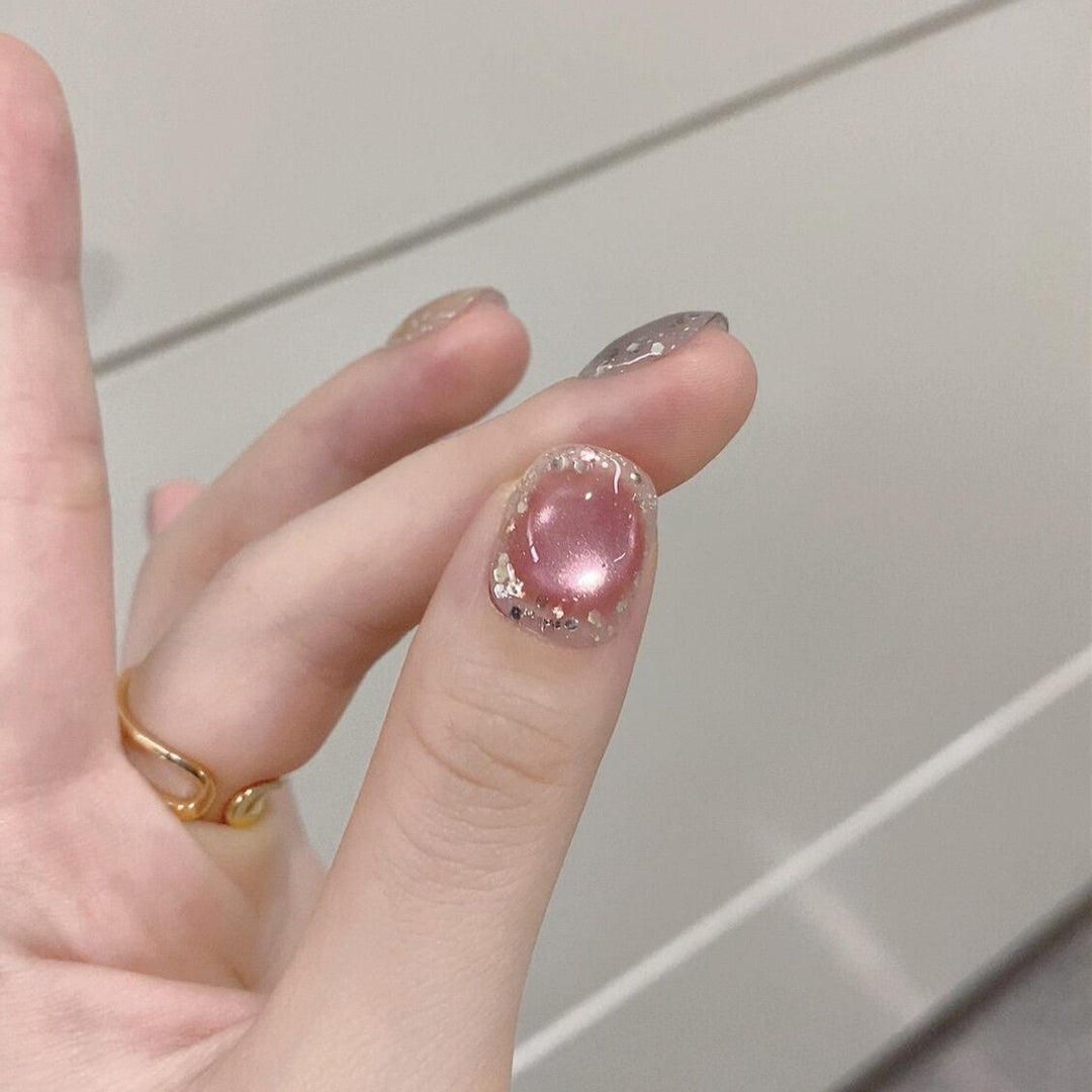 Artificial acrylic nails with shimmering effects and elegant glitter accents Kalsten