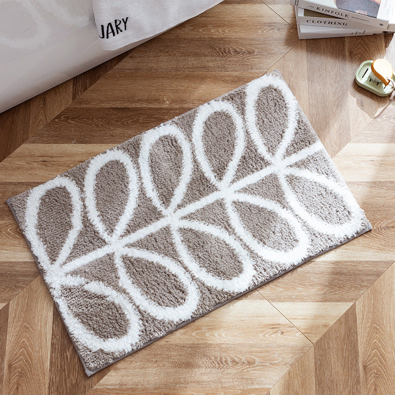 Fluffy bath mat in a graphic wave relief with anti-slip base Kalsten