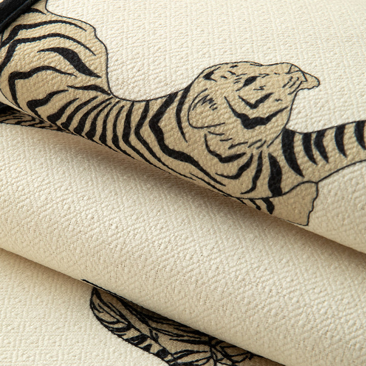 Woven cotton-linen table runner with tiger print and decorative tassels