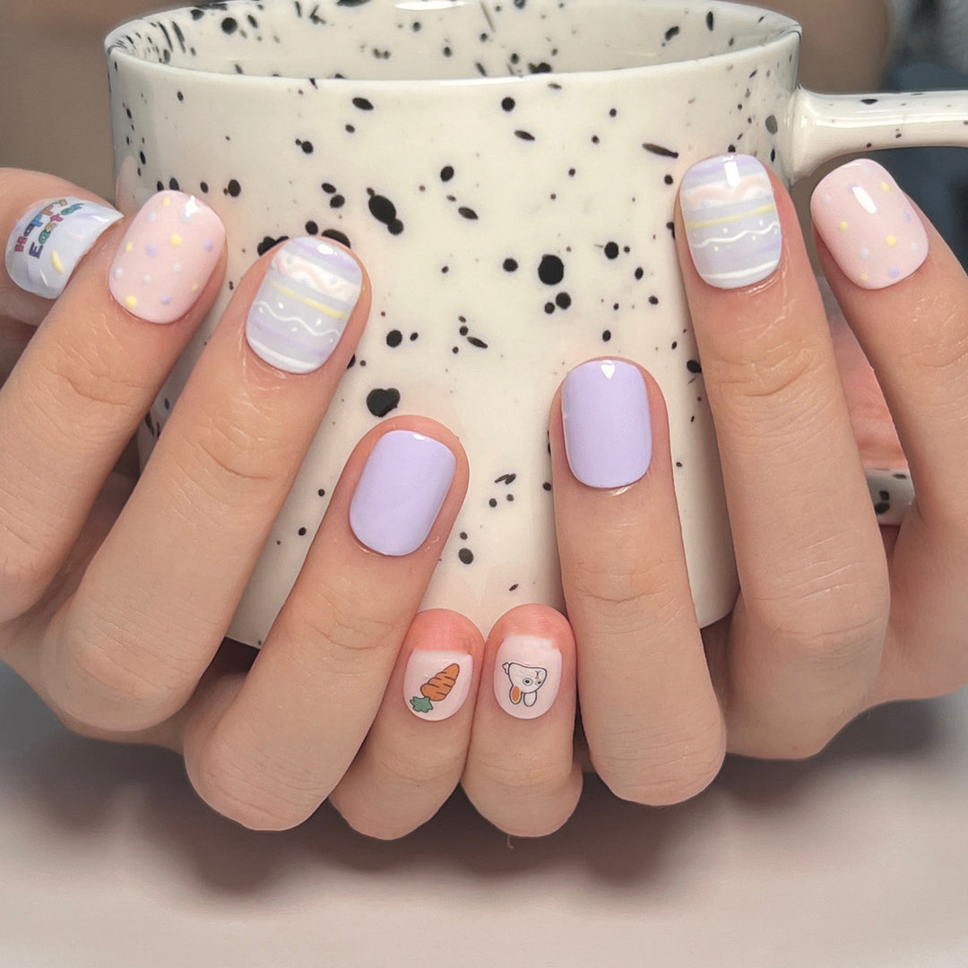 Artful nail art with cute animal motifs and pastel-colored design Kalsten