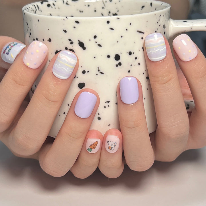 Artful nail art with cute animal motifs and pastel-colored design Kalsten