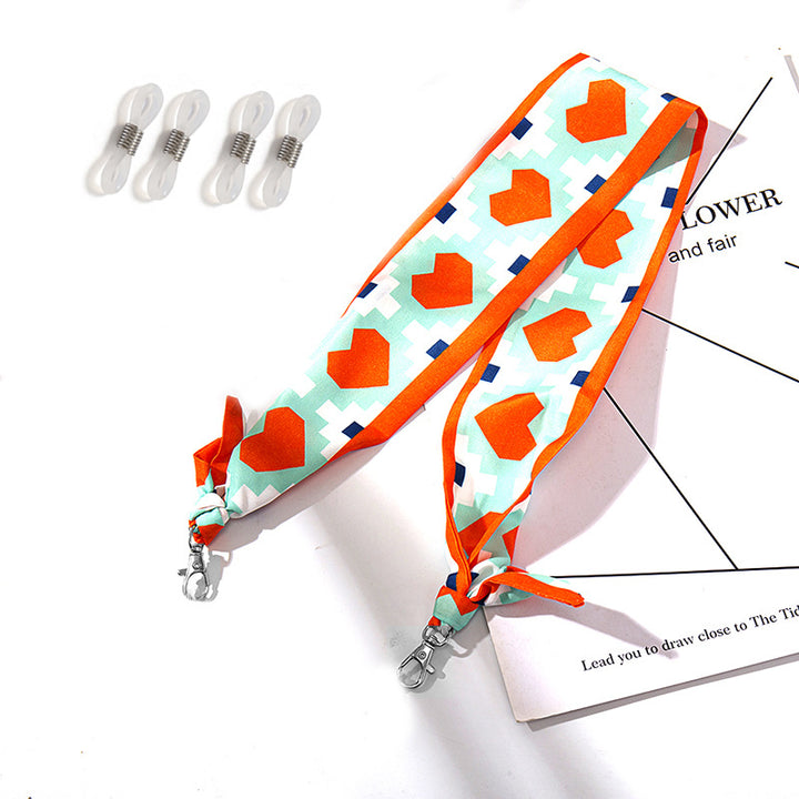 Fashionable fabric mask holder with floral motifs Kalsten