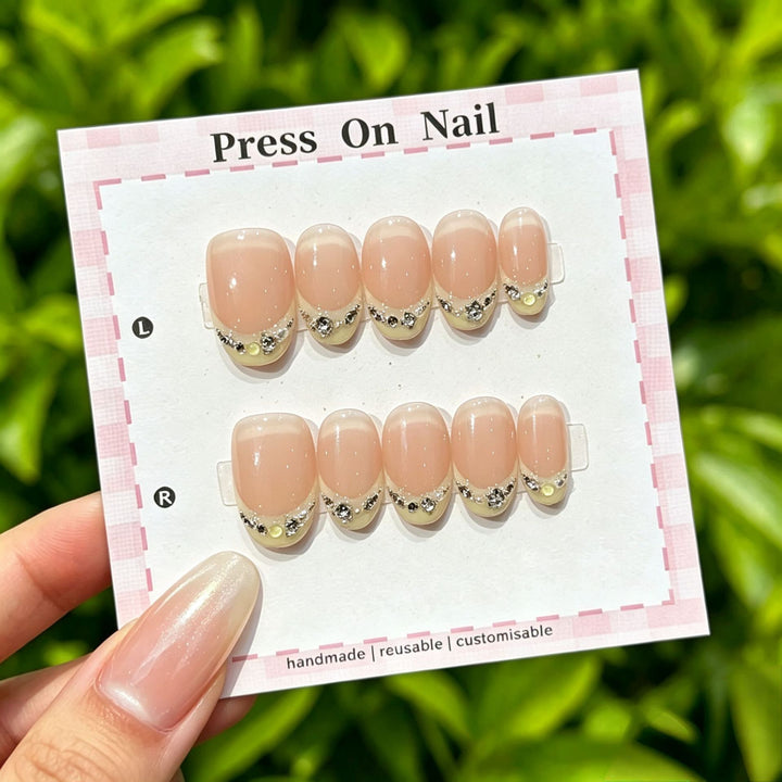 Artistic Press-On Nail Art Set with Cute Character and Bow Accents