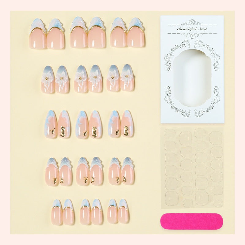 Creative nail set with elegant gold embellishments Kalsten