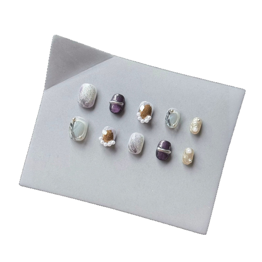 Artistic Press-On Nail Art Set with Unique Textures and Pearl Accents