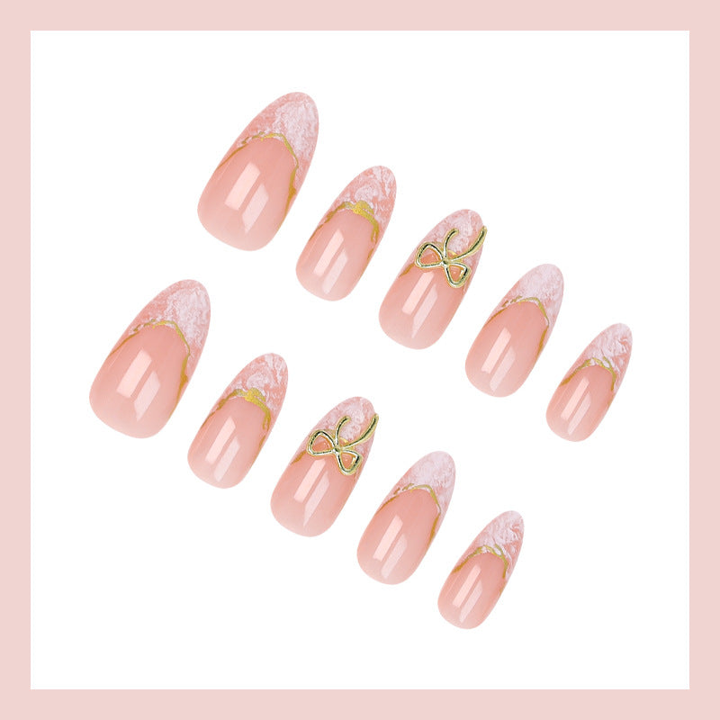 Acrylic nail set with elegant tips and delicate embellishments Kalsten
