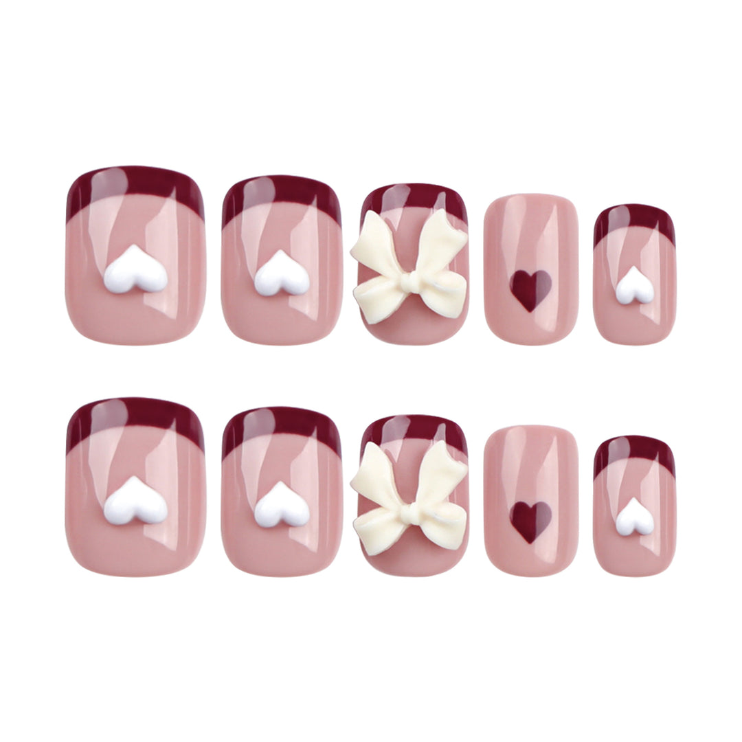 Artful nail art with heart and bow motifs Kalsten