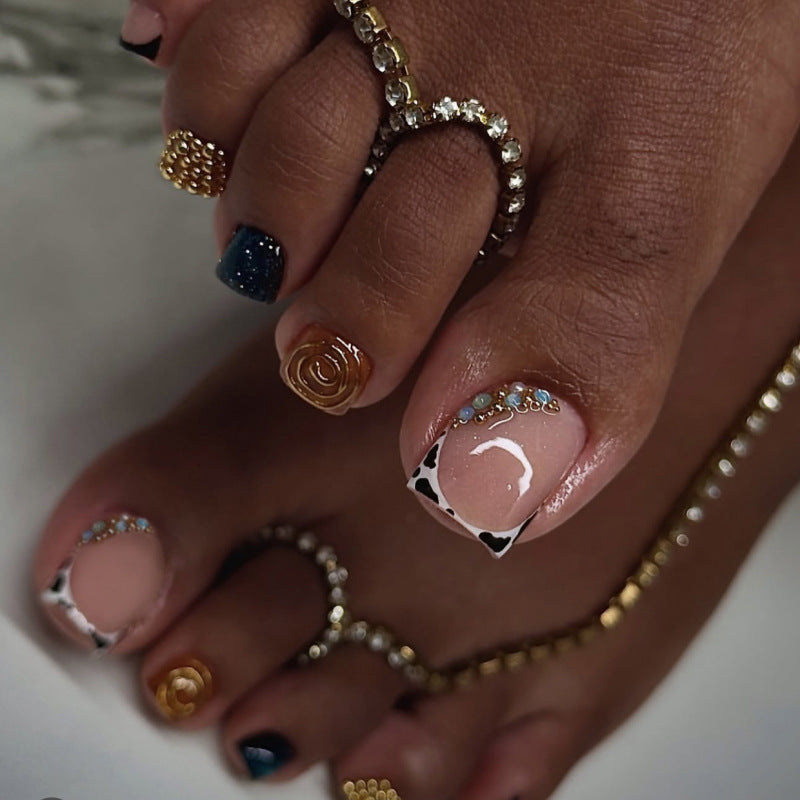 Artful toenail design with floral and sparkling accents Kalsten