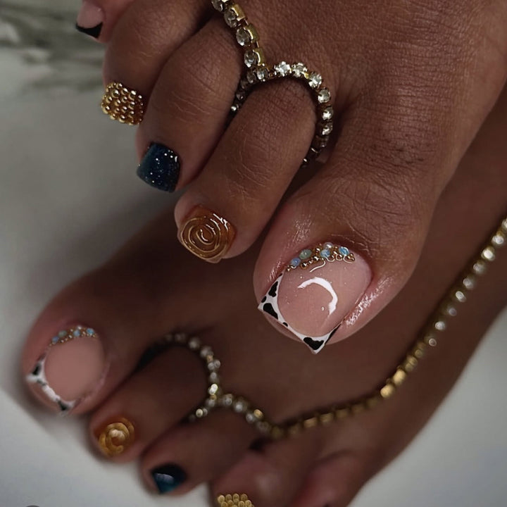 Artful toenail design with floral and sparkling accents Kalsten