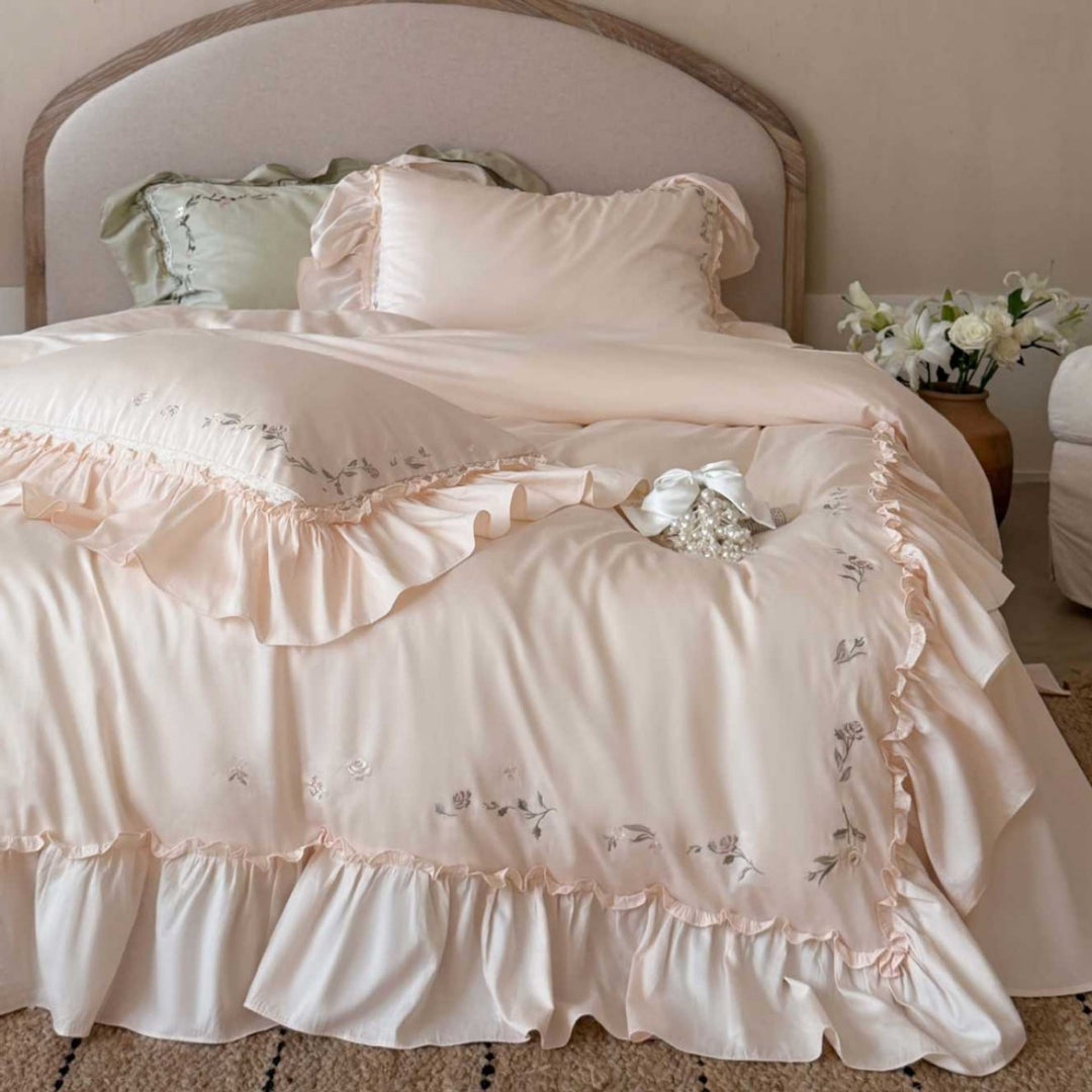 Elegant bedding set made of cotton satin with ruffles, delicate floral embroidery, and frills