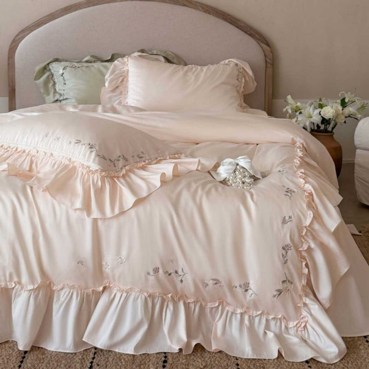 Elegant bedding set made of cotton satin with ruffles, delicate floral embroidery, and frills