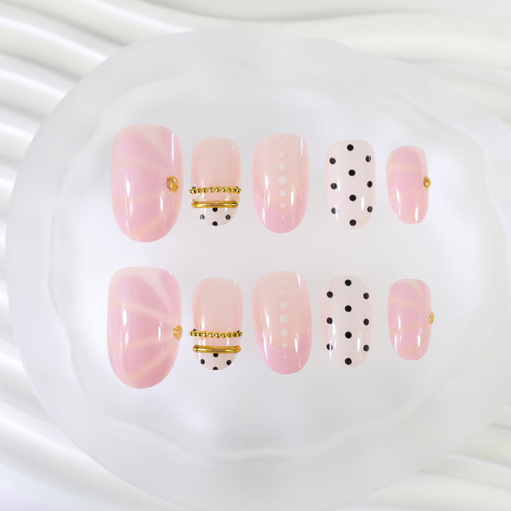 Acrylic nail set with elegant polka dot and glamorous golden accents Kalsten