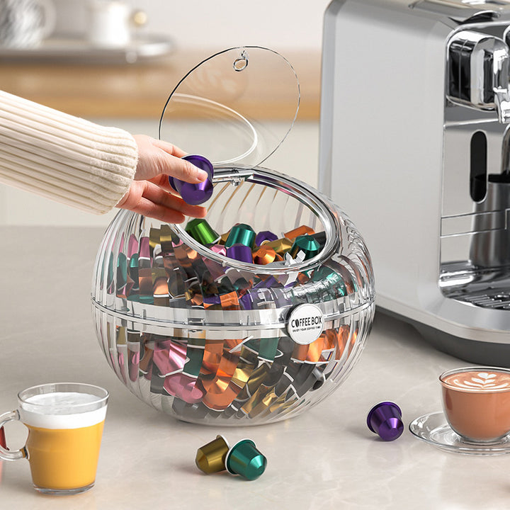 Spherical coffee capsule dispenser made of clear acrylic with flip lid
