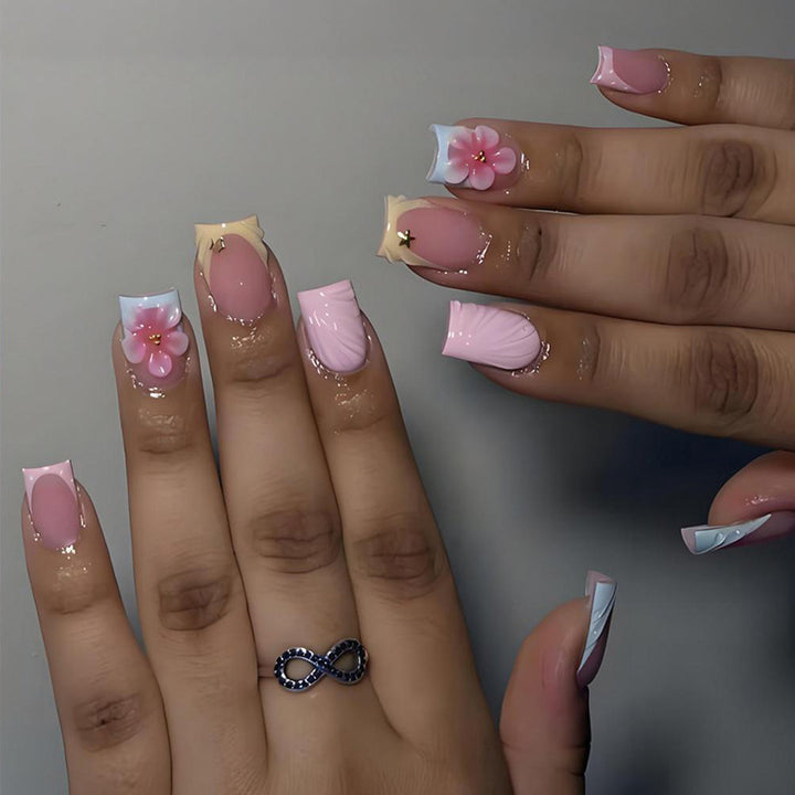 Acrylic nail set with elegant flower motifs and colorful designs Kalsten