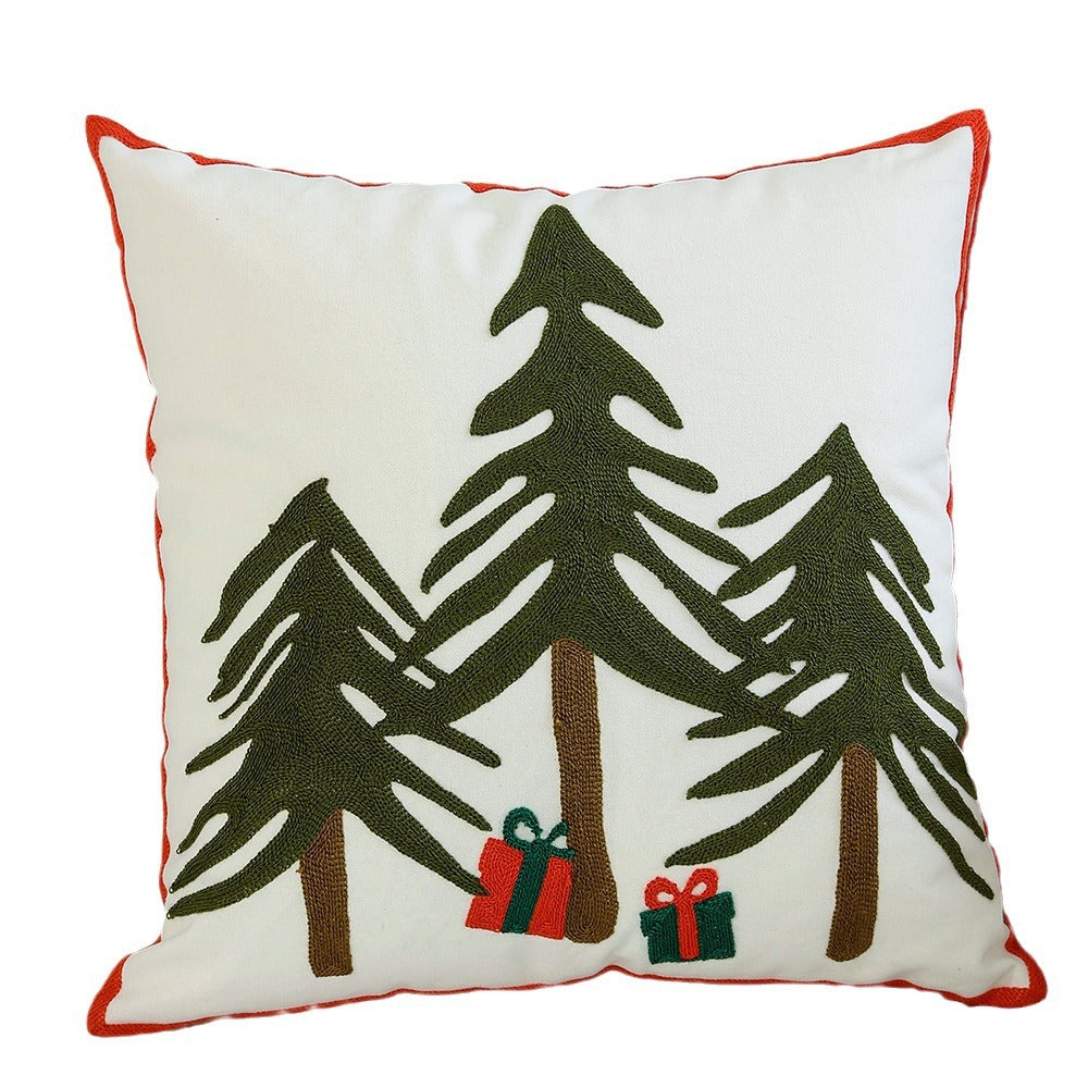 Hand-stitched winter decorative sofa cushion with sled and fir motif