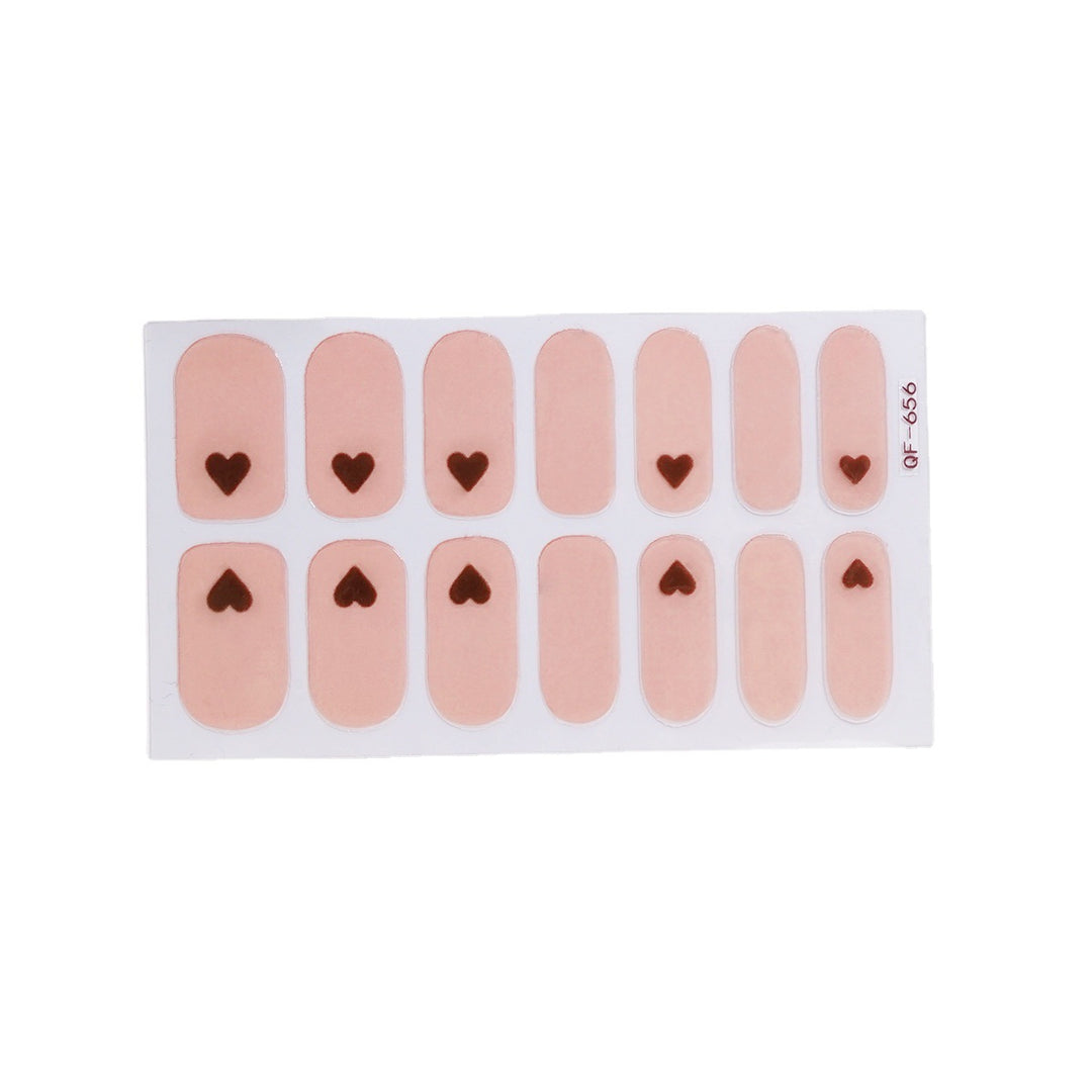 Artificial nail art with heart-shaped designs and soft color gradients Kalsten
