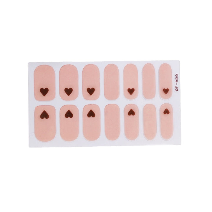 Artificial nail art with heart-shaped designs and soft color gradients Kalsten