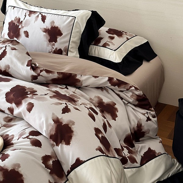 Luxury bed cover set made of cotton satin with abstract watercolor flower print and contrasting ruffle