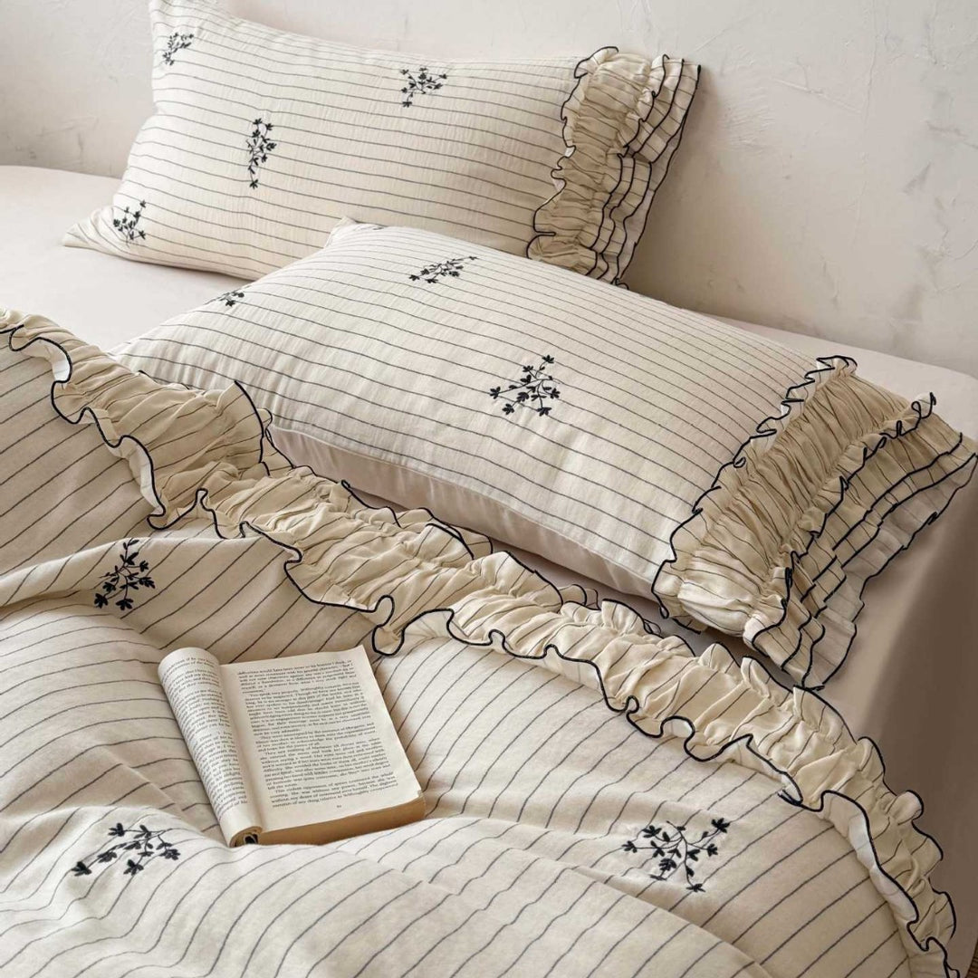 Romantic bedding set with ruffle, fine floral embroidery and pinstripes