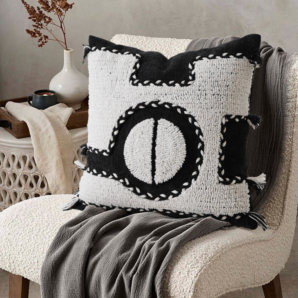 Square hand-tufted decorative pillow with geometric high-pile relief
