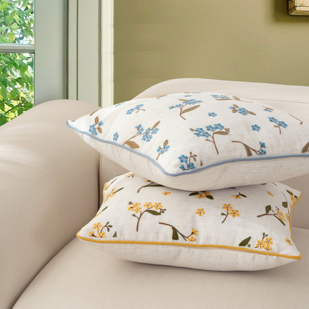 Decorative embroidered cushion cover made of linen blend with floral yellow flower appliqué and piping Kalsten