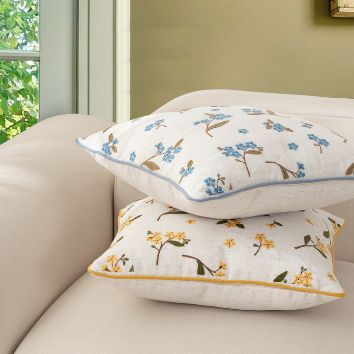 Decorative embroidered cushion cover made of linen blend with floral yellow flower appliqué and piping Kalsten
