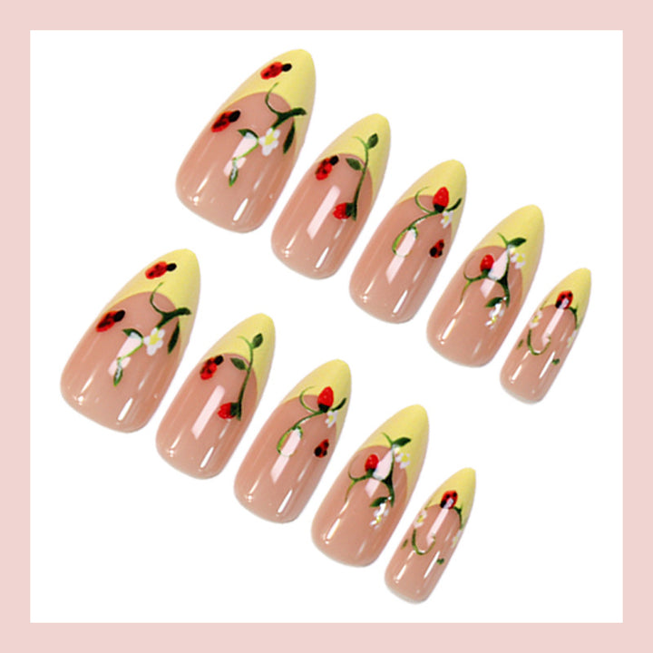 Artificial nail set with elegant gradient and floral accents Kalsten