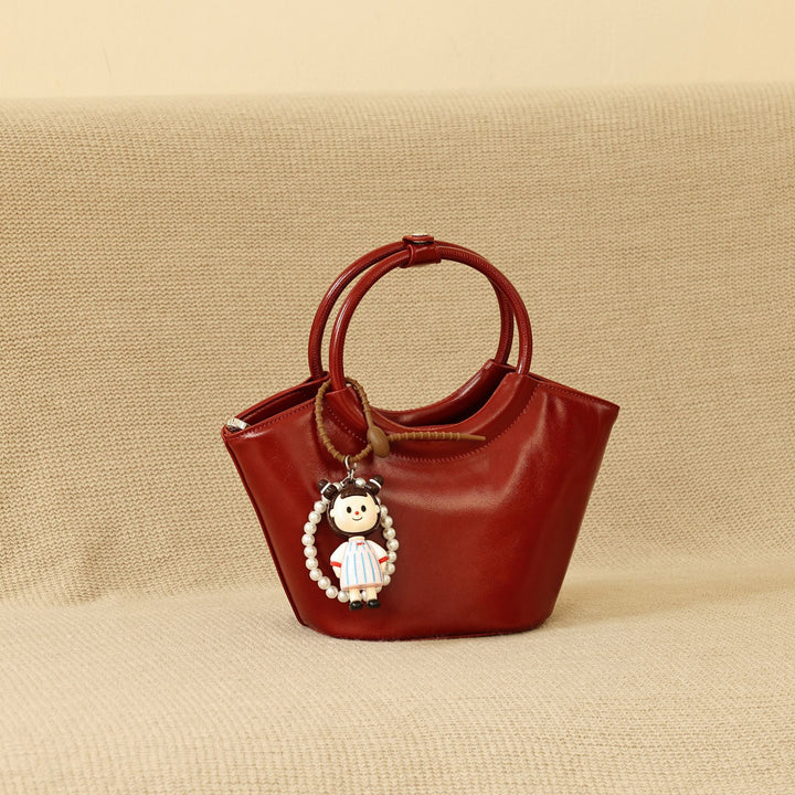 Chic Structured Handbag with Decorative Charm