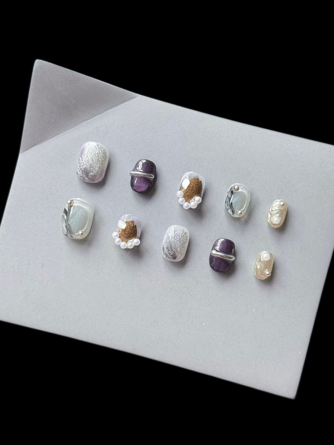 Artistic Press-On Nail Art Set with Unique Textures and Pearl Accents