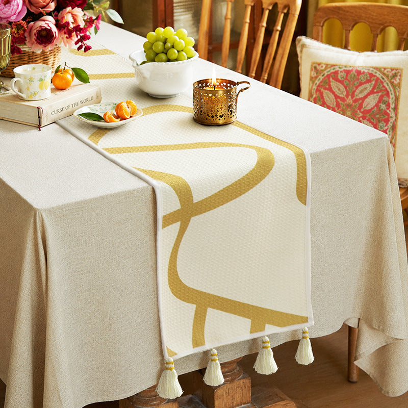 Light waffle texture throw blanket with geometric print and tassels