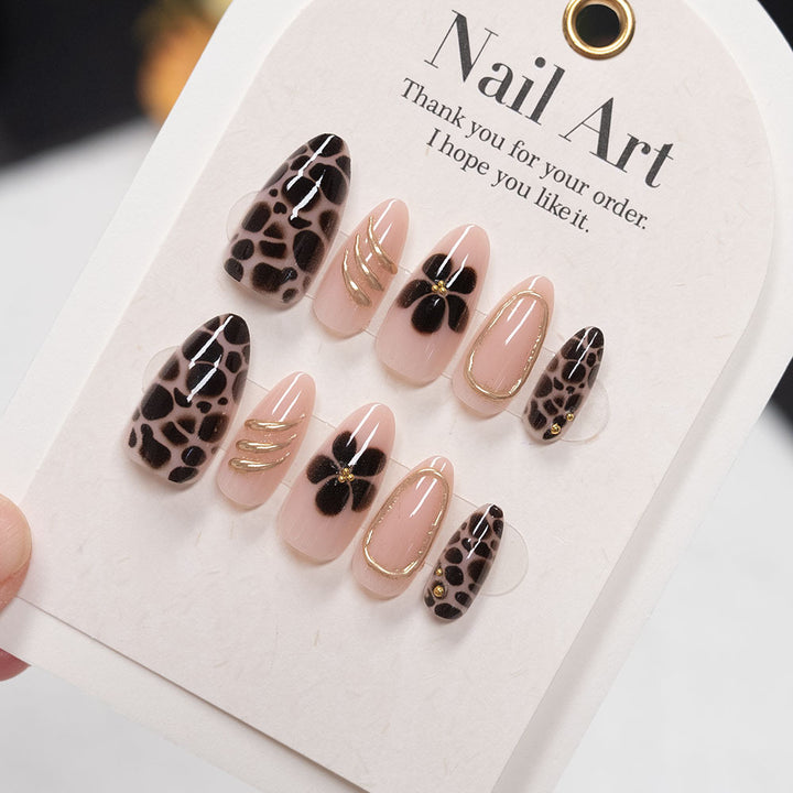 Artistic Press-On Nail Set with Floral and Gold Accents