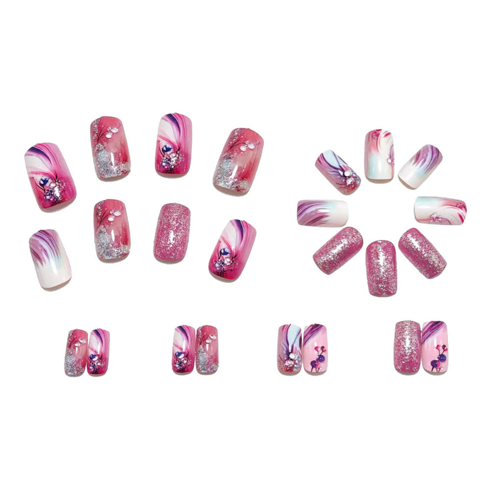 Glamorous artificial nails with delicate flower design and glitter accents Kalsten