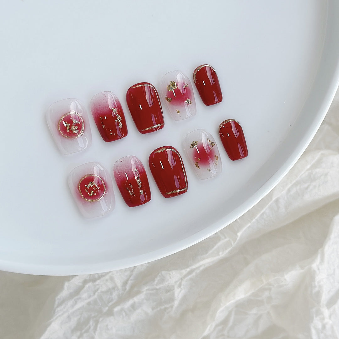 Artistic Press-On Nail Set with Floral and Golden Accents