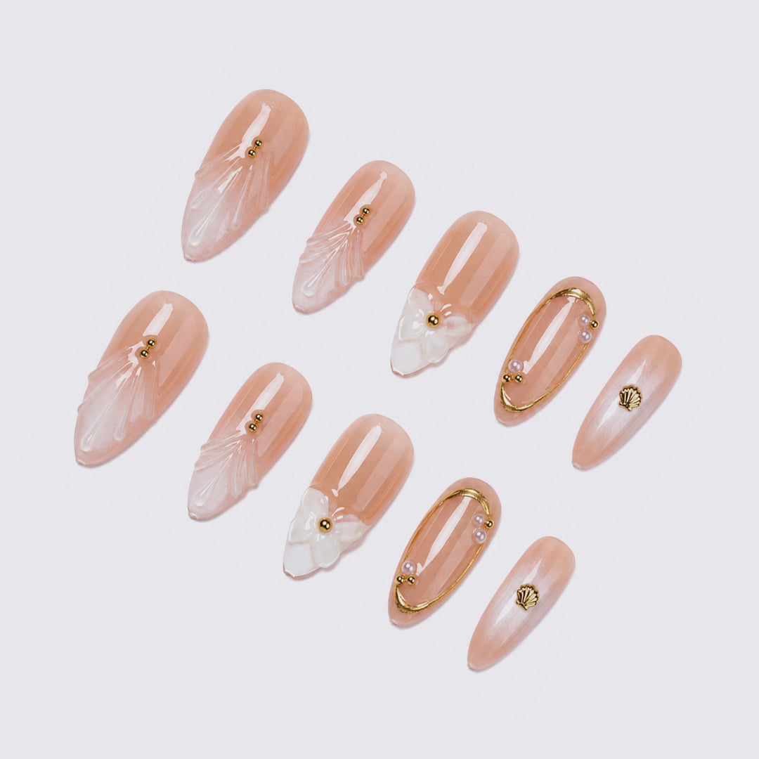 Acrylic nail set with floral 3D designs and elegant golden accents Kalsten