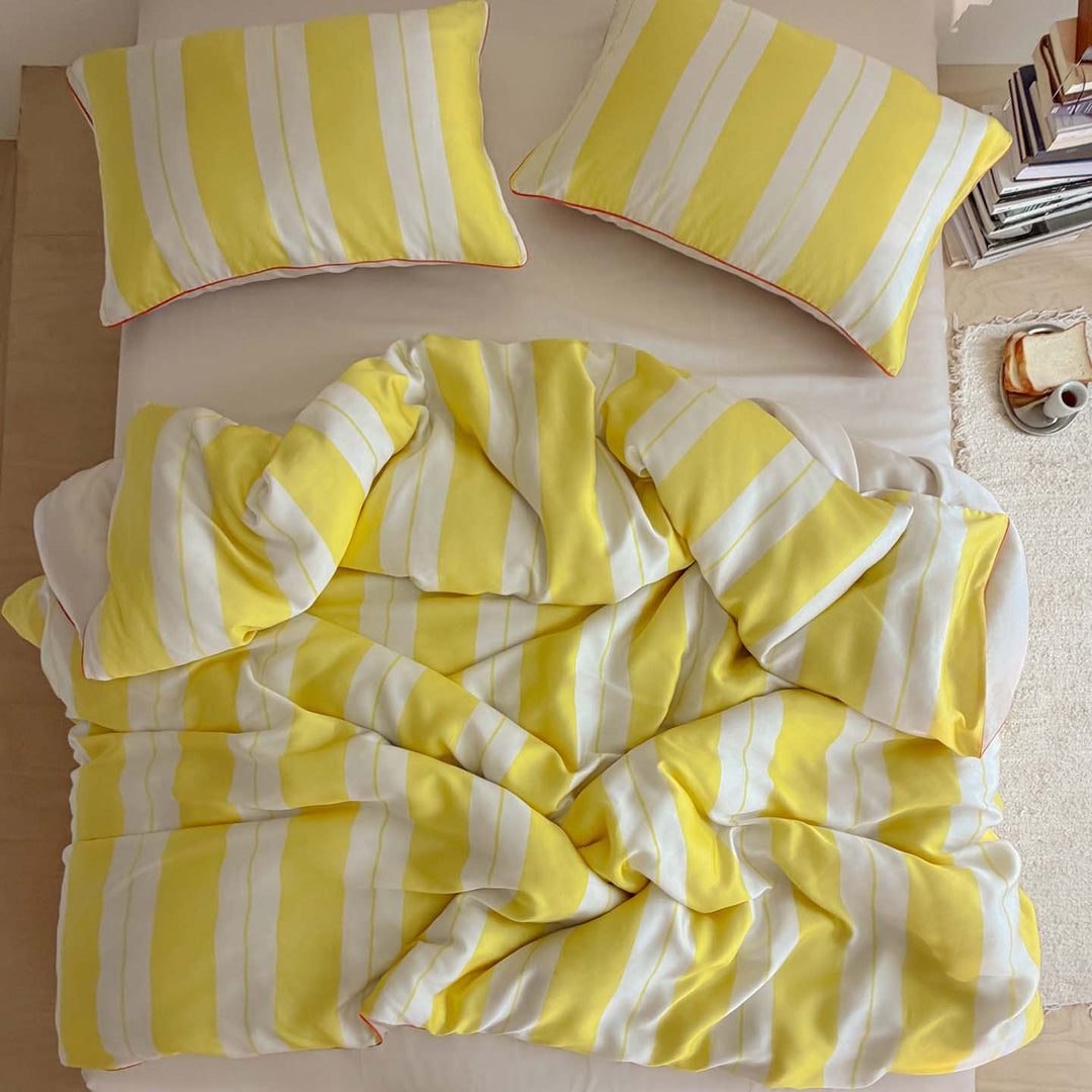 Luxurious cotton satin bedding set with fine striped pattern and piping