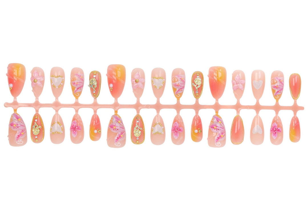 Artificial nail set with delicate flower designs and glamorous accents Kalsten