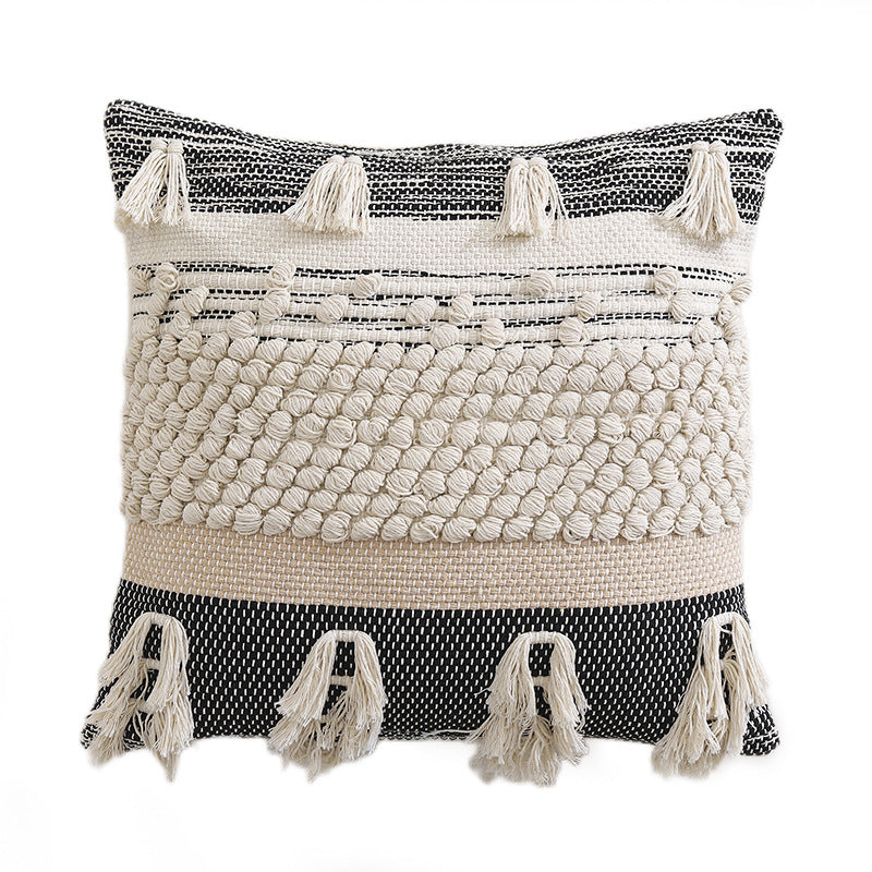 High-structured woven decorative cushion cover with fringes and bouclé application