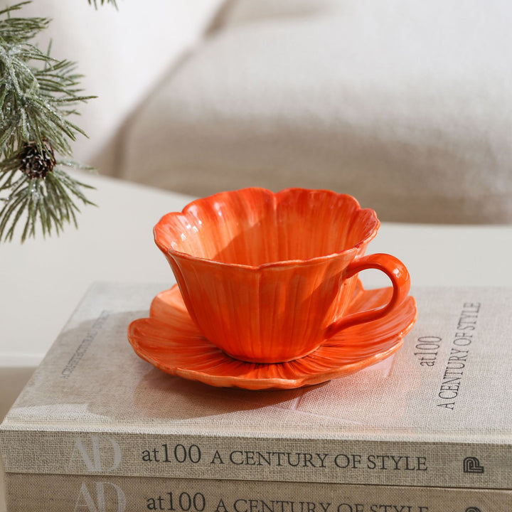 Ceramic mug with saucer in flower shape
