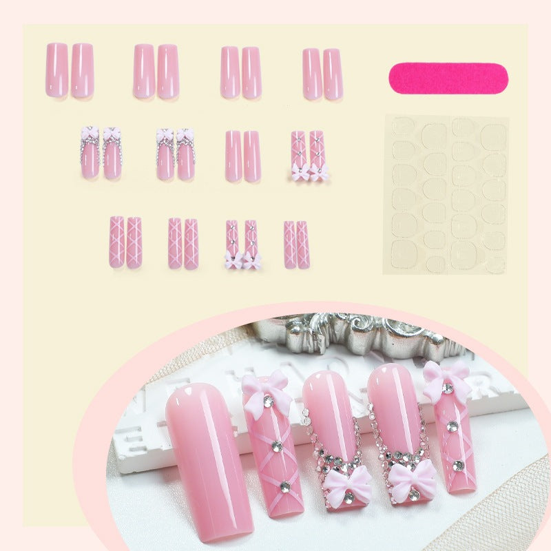 Acrylic nail set with elegant bow and glitter accents Kalsten